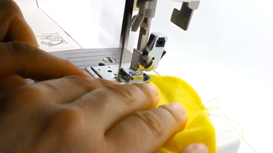 costura de doblez en tela para guantes de bebé