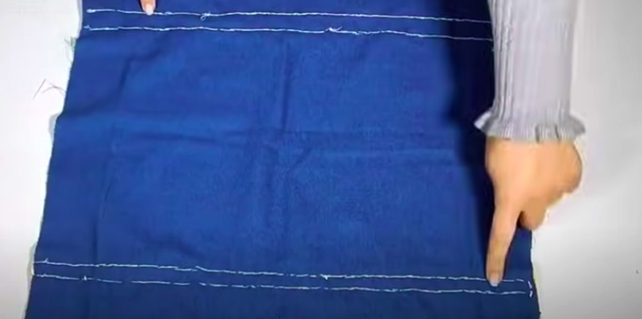 realización de doble costura de unión de las tela para guarda bolsas