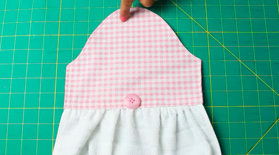 costura de botón en tela superior para agarradera de hornalla