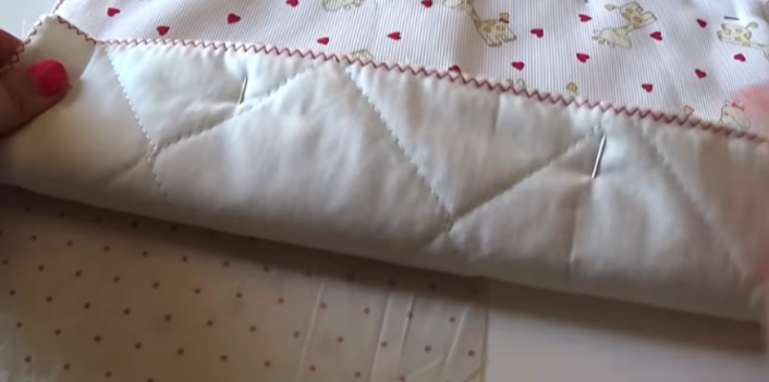 unión de tela exterior y huata para bolsa de bebé